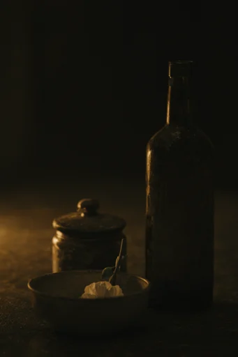 Cinematic Tenebrism Noir style reference image — chiaroscuro lighting
