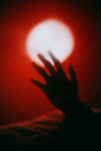 Crimson Astral Surrealism style reference image — analog film grain