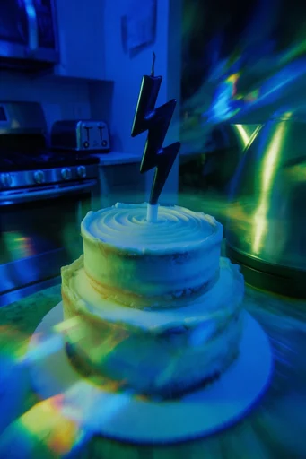 Luminous Cobalt Cyber-Noir style reference image — prismatic lens refraction