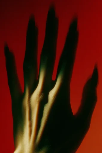Cinematic Crimson Noir style reference image — sharp chiaroscuro shadows