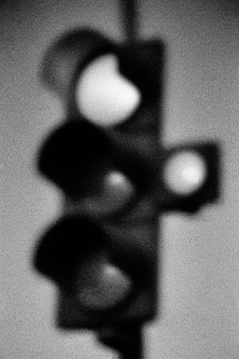 Gritty Chiaroscuro Noir style reference image — heavy film grain