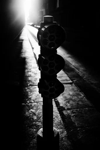 Monochromatic Noir Architecture style reference image — chiaroscuro lighting