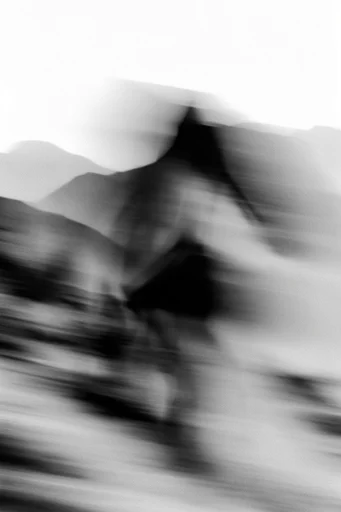 Kinetic Monochrome Noir style reference image — motion blur photography