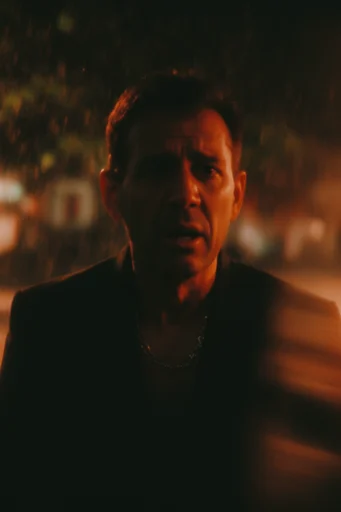 Cinematic Amber Noir style reference image — lo-fi film grain