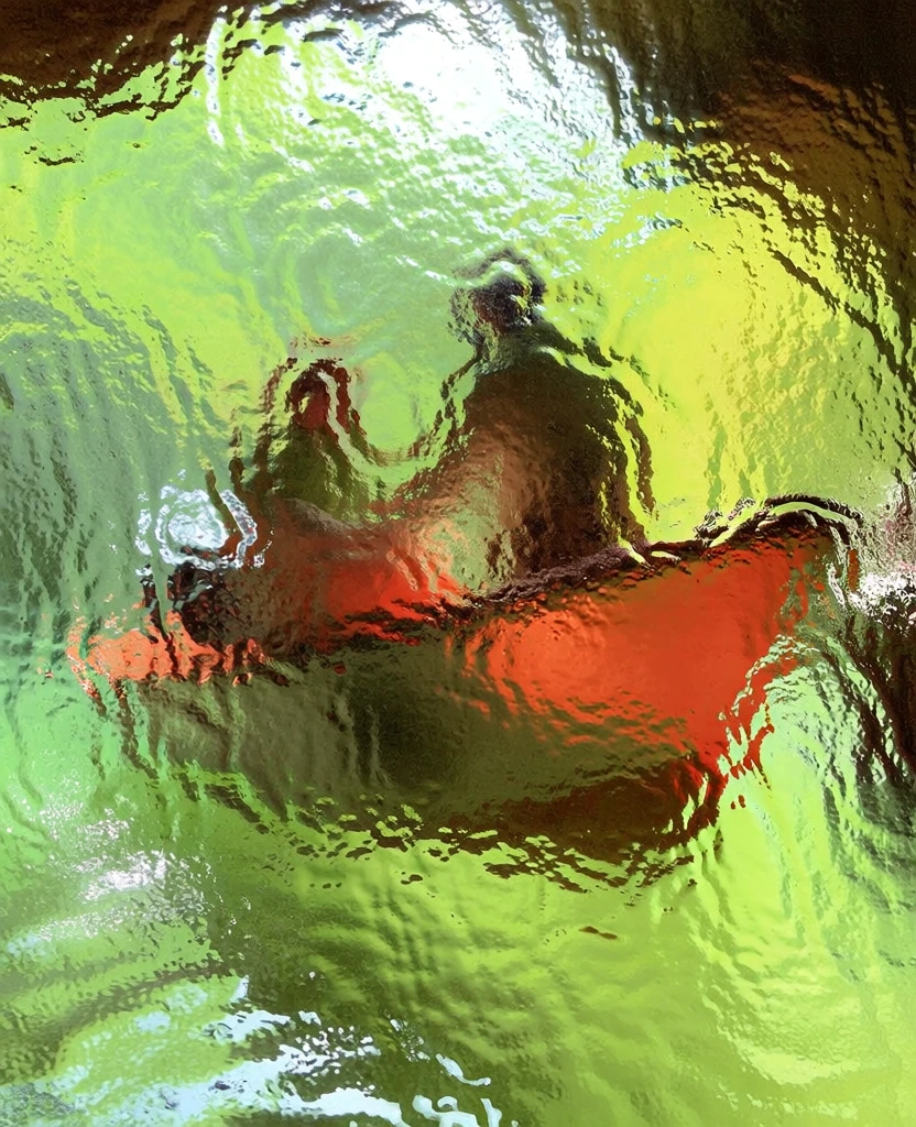 a boat with two figures floating in a cave, viewed through a pane of textured hammered cathedral glass, extreme optical distortion, fluid fragmented forms, dominant palette of neon chartreuse and electric lime, sharp punch of saturated traffic-cone orange on the boat hull, deep umber and mossy green shadows, high-energy surface tension, liquid-like light refraction, impressionistic abstraction, high-key backlighting, flattened depth of field, vibrant acid-toned atmospheric glow.