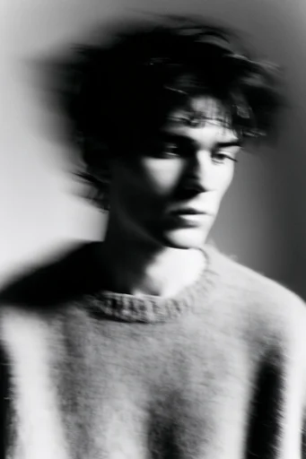 Ethereal Monochrome Motion style reference image — chiaroscuro lighting