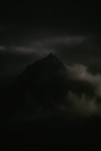 Cinematic Chiaroscuro Noir style reference image — deep indigo and amber palette