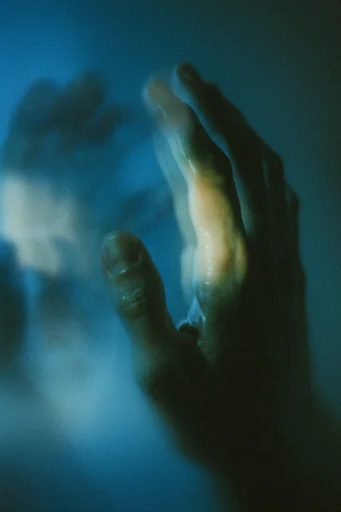 Kinetic Thermal Melancholy style reference image — heavy film grain