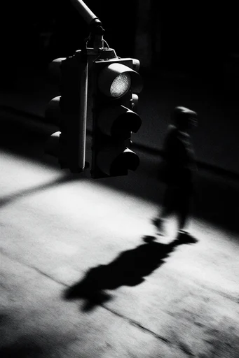 Ghostly Chiaroscuro Noir style reference image — low-key photography