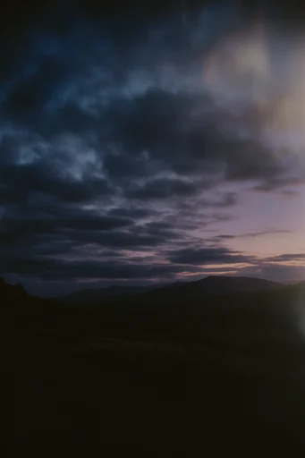 Cinematic Twilight Solitude style reference image — analog film grain
