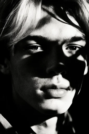 Cinematic Noir Portraiture style reference image — high-contrast black and white