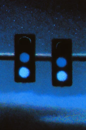 Luminous Spectral Noir style reference image — heavy analog film grain