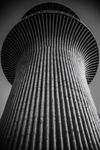 Monolithic Brutalist Vertigo style reference image — imposing scale