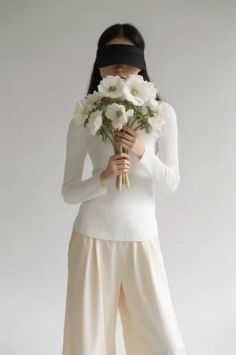 Sculptural Neutral Minimalism style reference image — high-fashion photography