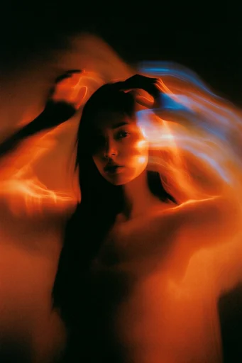 Ethereal Kinetic Noir style reference image — warm amber and electric blue light