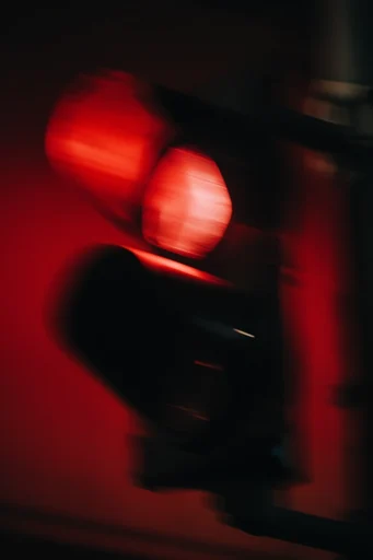 Crimson Kinetic Noir style reference image — motion blur